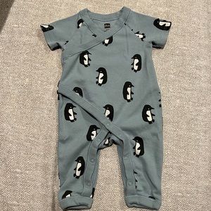 Tea Collection wrap neck romper in penguin pattern